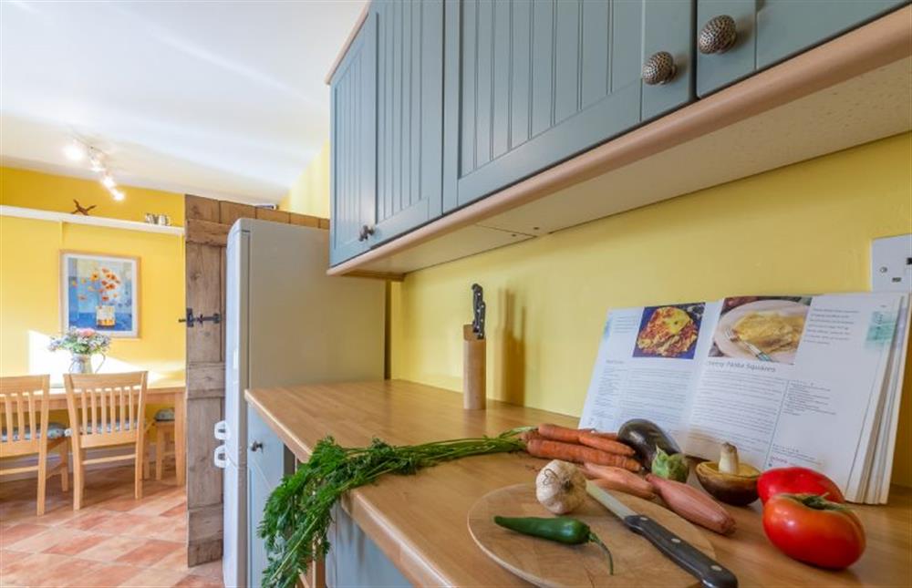 Ground floor: the Kitchen is fresh and bright at Plunketts Cottage, Brancaster near Kings Lynn