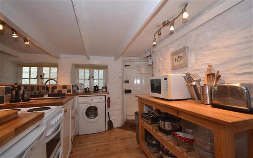 Another view of the kitchen, showing the front entrance at Pol Haven in Polperro