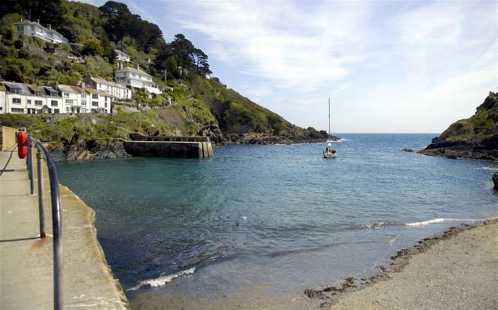 The harbour mouth, sea and local beach at Pol Haven in Polperro