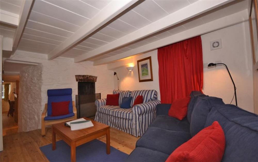 The living room, showing the door through to the kitchen/diner at Pol Haven in Polperro