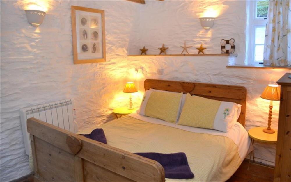 The pretty double bedroom on the first floor at Pol Haven in Polperro