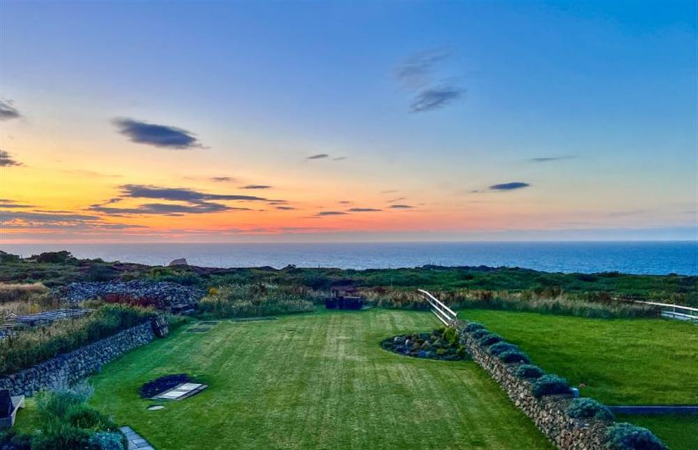 Enjoy the many wonderful colours of the sunset from the comfort of the Living area (photo 2) at Polberro Cottage, St Agnes