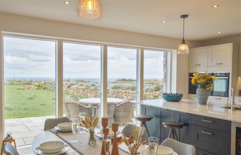 Large sliding doors connect the open-plan area to the beautiful garden at Polberro Cottage, St Agnes