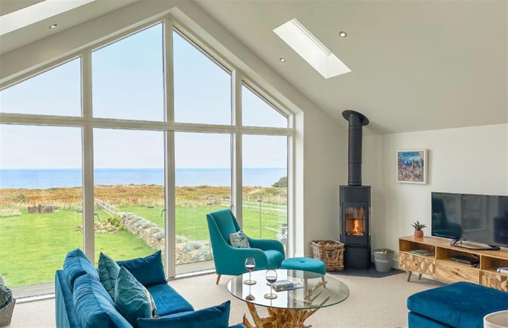 On cooler evenings, enjoy a family film in front of the wood-burning stove. at Polberro Cottage, St Agnes