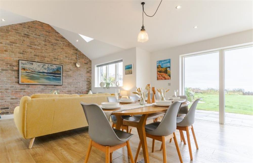 This open-plan area provides the perfect gathering spot for the entire group at Polberro Cottage, St Agnes