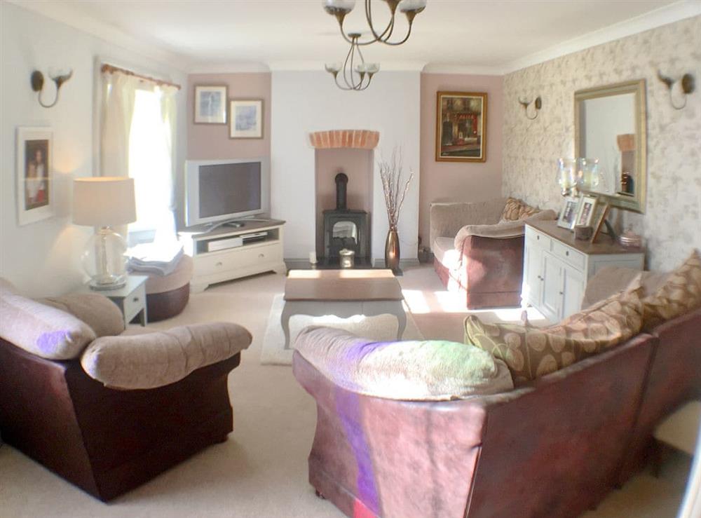 Comfortable living room with wood burner (photo 2) at The Old Farmhouse, 