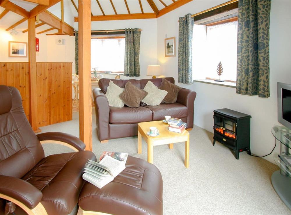 Open plan living space at Threpney Cottage, 