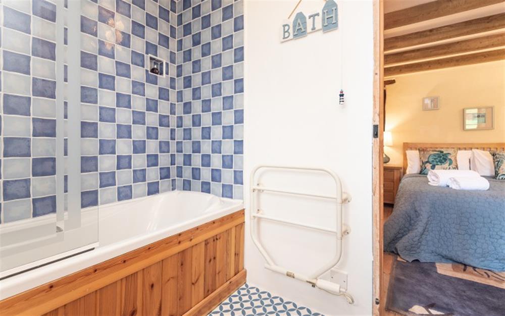 The en-suite bathroom with shower over, to second bedroom at Polgassic Mill in Polperro
