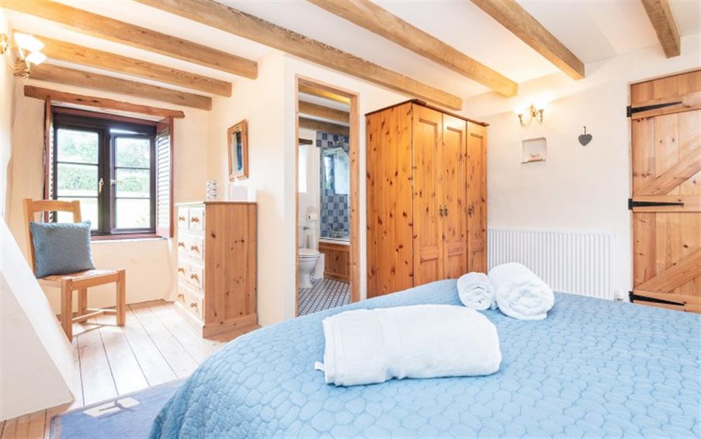 The second huge bedroom with en-suite and French windows to the decked terrace at Polgassic Mill in Polperro