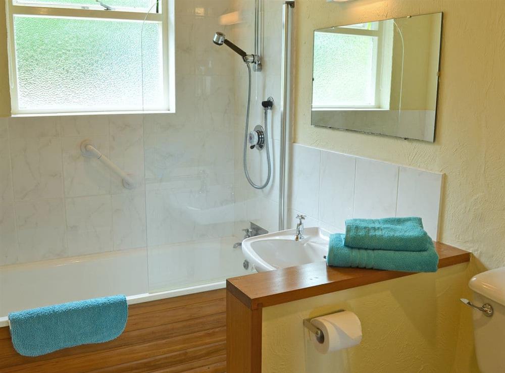 Bathroom with shower over bath at Morvoren, 