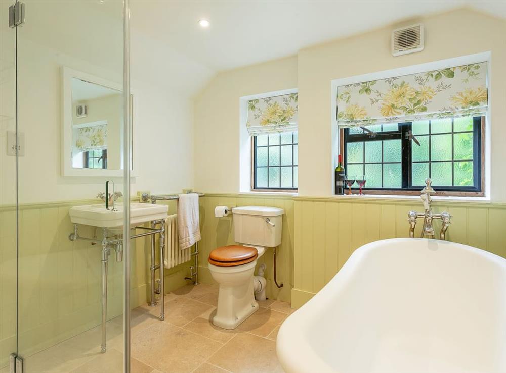 Bathroom with separate shower at Pollard Cottage in Lingfield, Surrey
