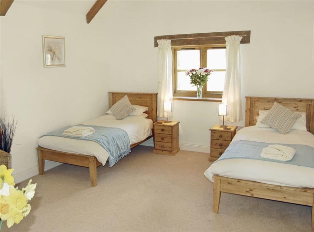 Twin bedroom at Polmear Barn in Tregoodwell, Camelford, Cornwall., Great Britain