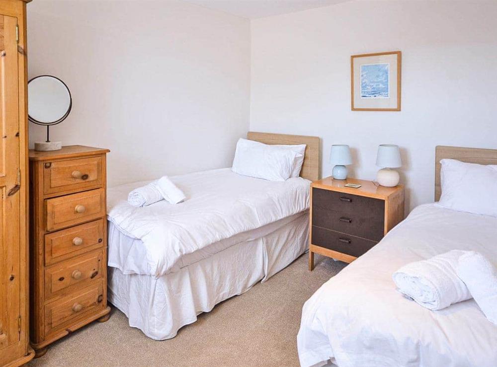 Ground floor twin bedroom at Polvarth Cottage in St Mawes, Cornwall