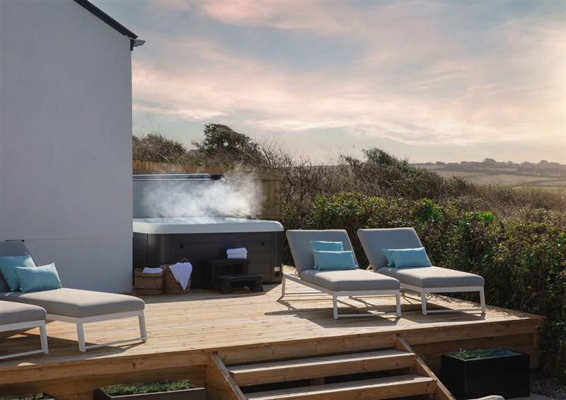 Enjoy a glass of wine on the patio at Polview, Crantock