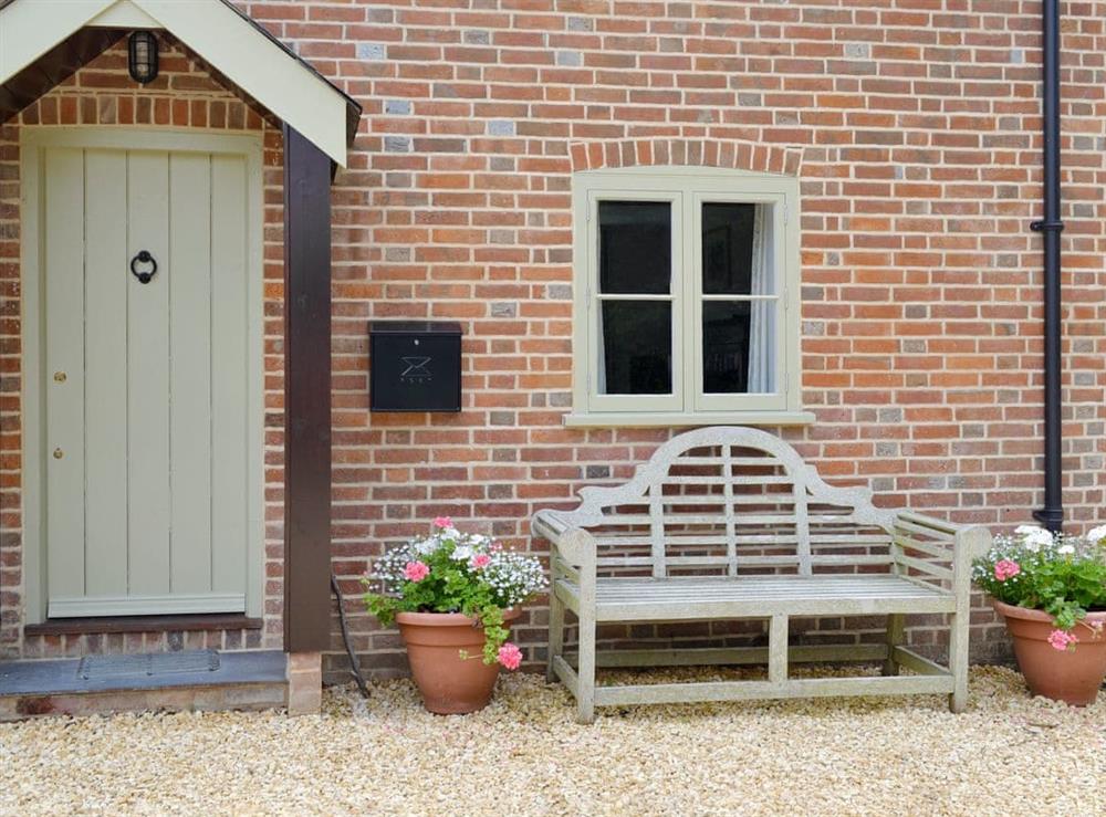 Charming entrance with outdoor seating at Pond Cottage in Boldre, near Lymington, Hampshire