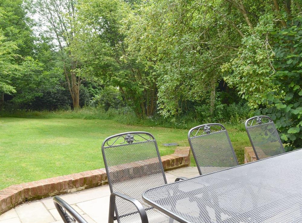 Outdoor furniture on the terrace at Pond Cottage in Boldre, near Lymington, Hampshire