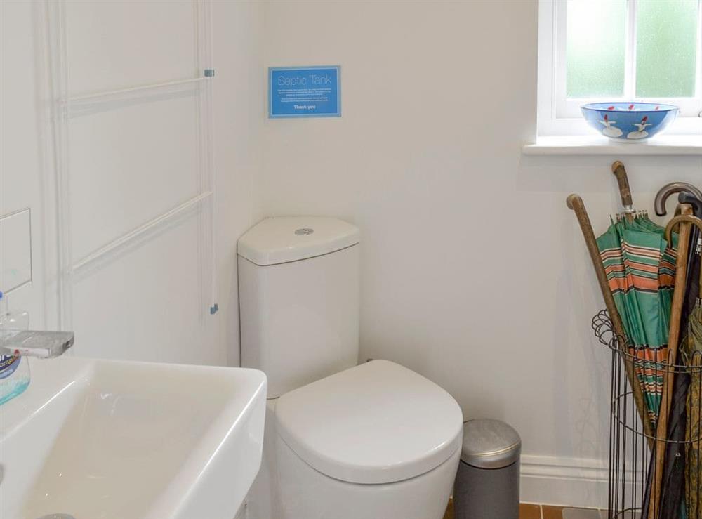 Utility room with toilet at Pond Cottage in Boldre, near Lymington, Hampshire