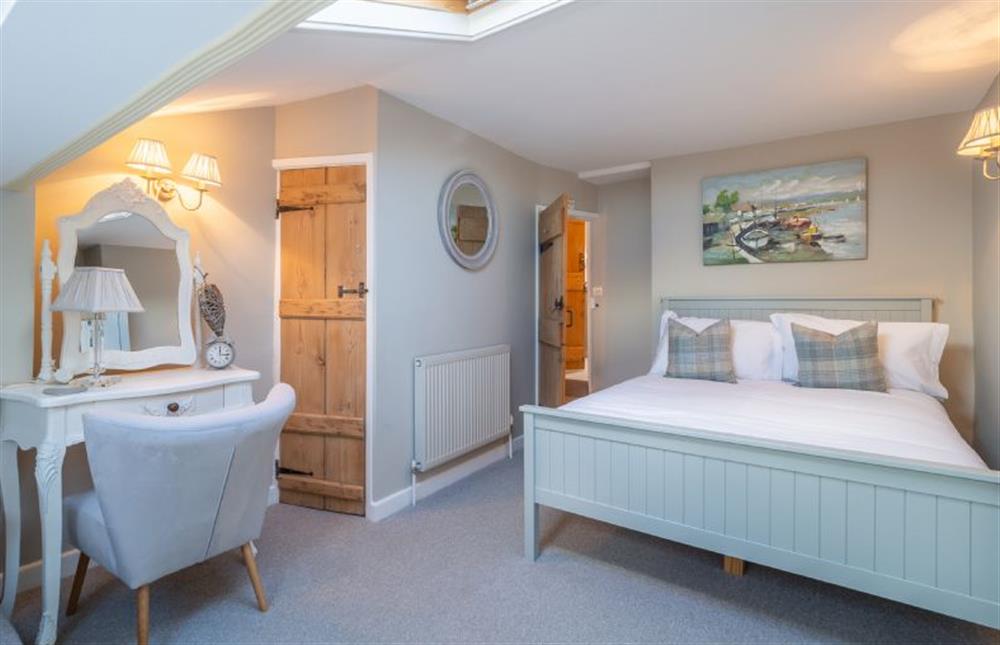 First floor: Bedroom two has a double bed and single in the eaves at Pond Cottage, Docking near Kings Lynn
