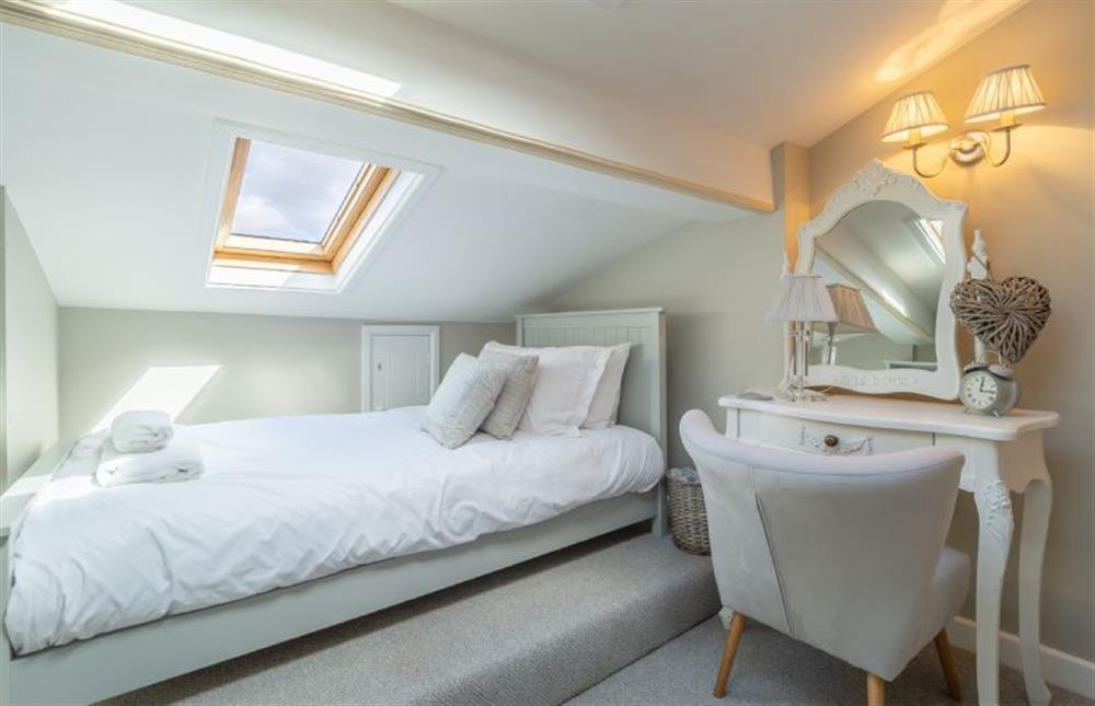 First floor: Bedroom two with single bed in the eaves at Pond Cottage, Docking near Kings Lynn