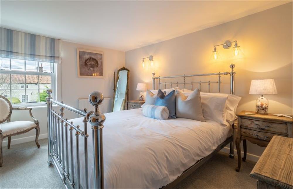 First floor: Master bedroom with king-size bed at Pond Cottage, Docking near Kings Lynn