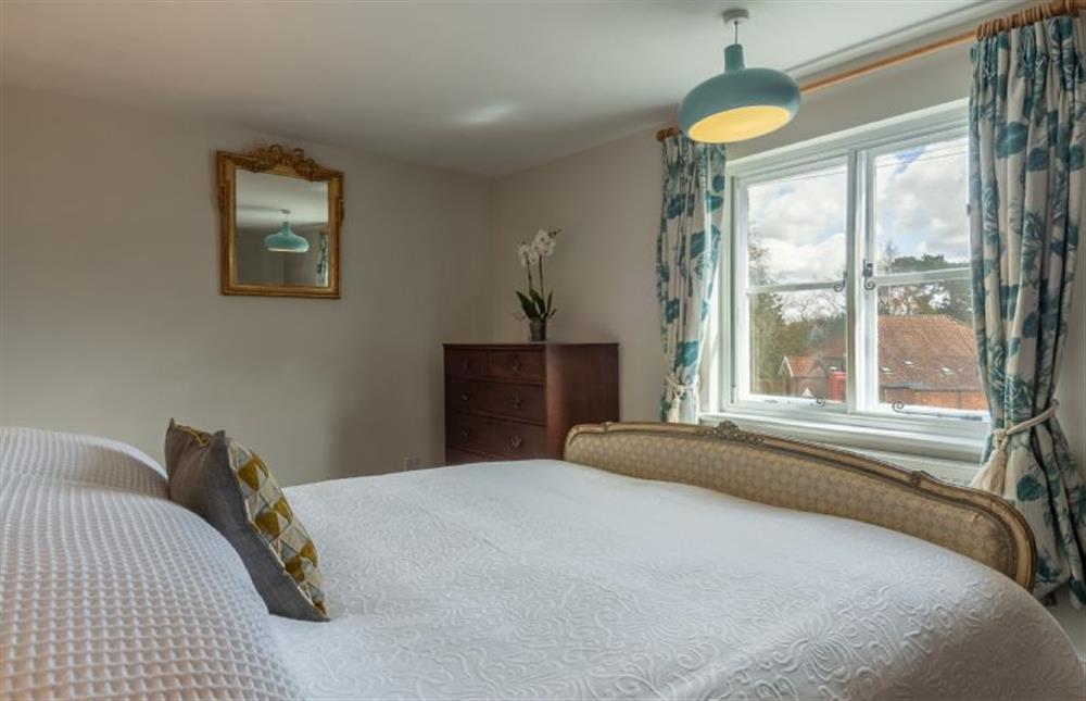 First floor: Master bedroom with village views at Pond Cottage, Edgefield near Melton Constable