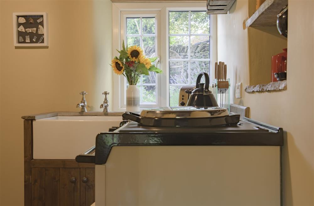 Kitchen overlooking the pretty garden to the rear of the cottage at Pond Cottage, West Witton, Leyburn, North Yorkshire