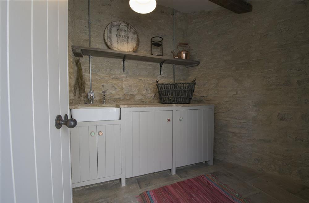 Utility area with washing machine and space for lockable bike storage at Pond Cottage, West Witton, Leyburn, North Yorkshire