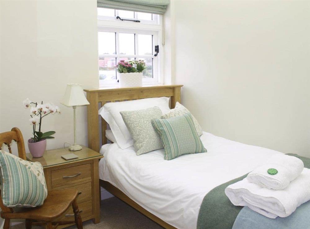 Bright single bedroom with feature lighting at Pond View Cottage in Brantingham, near Brough, North Humberside
