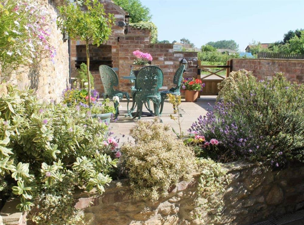 Colourful patio garden at Pond View Cottage in Brantingham, near Brough, North Humberside