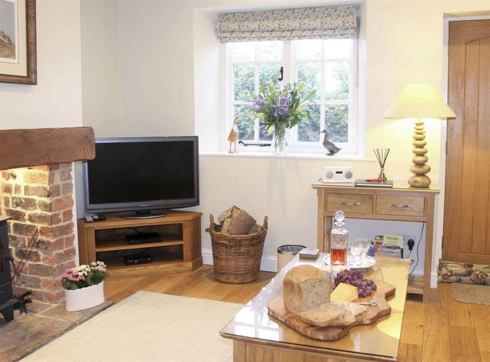 Tastefully decorated living space at Pond View Cottage in Brantingham, near Brough, North Humberside