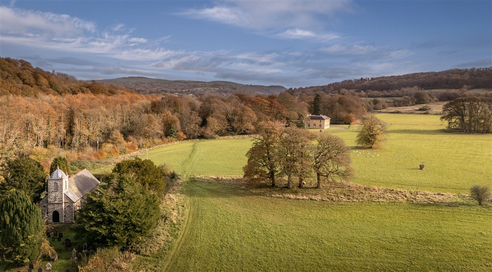 An aerial view of the Llanerchaeron estate with the Georgian Villa in the centre, near Abermydyr and Pontbrenmydyr cottages, Ceredigion at Pontbrenmydyr in Aberaeron, Ceredigion