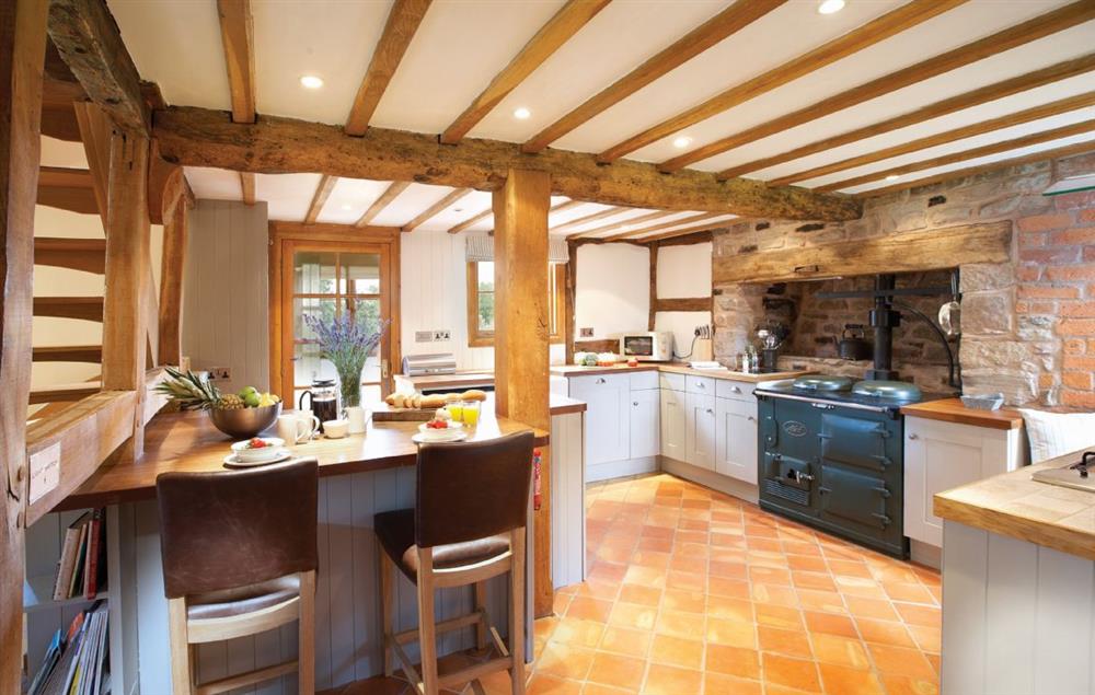 Open plan, fully fitted kitchen with dining area at Pool Head Cottage, Westhide