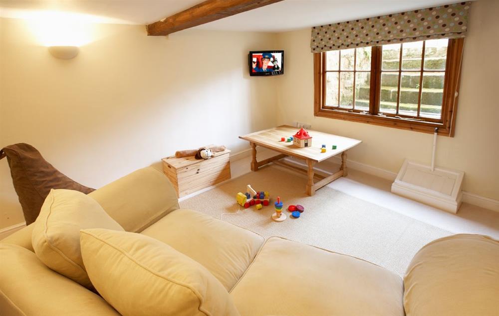 Snug/children’s play room with large sofa bed for visitors (no charge) at Pool Head Cottage, Westhide