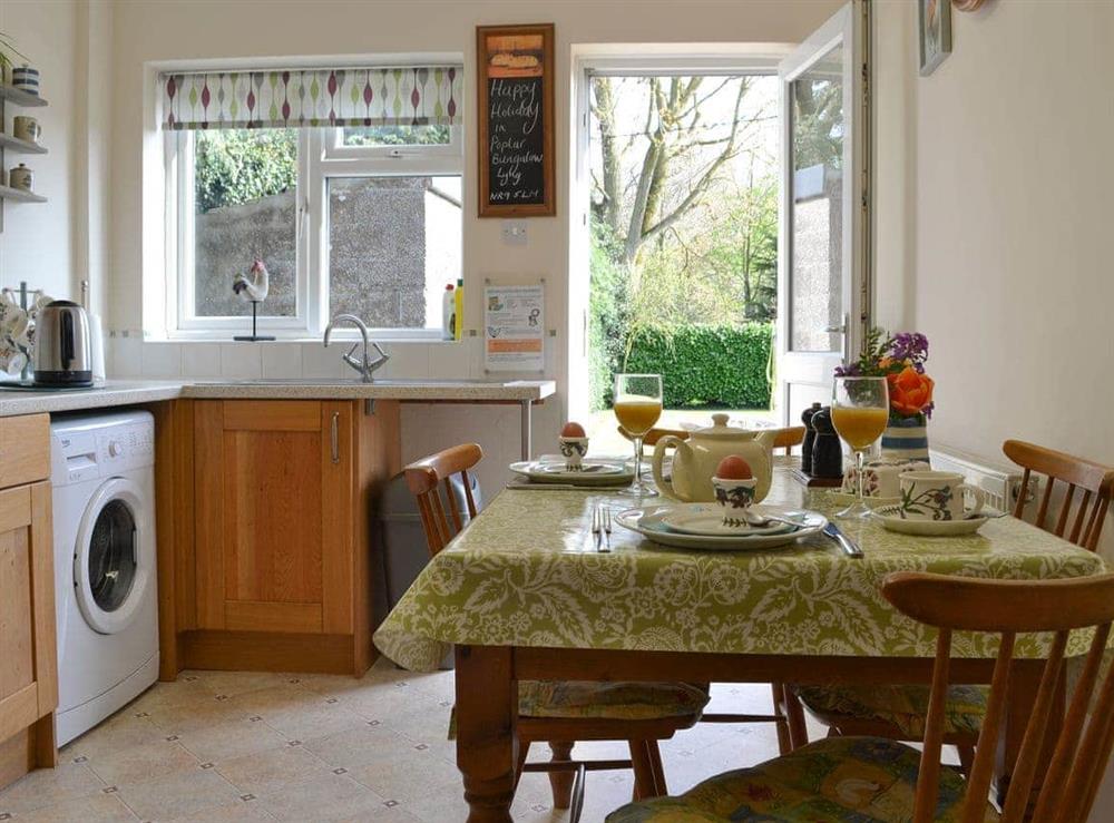 Well-equipped kitchen with dining area at Poplar Bungalow in Lyng, near Norwich, Norfolk