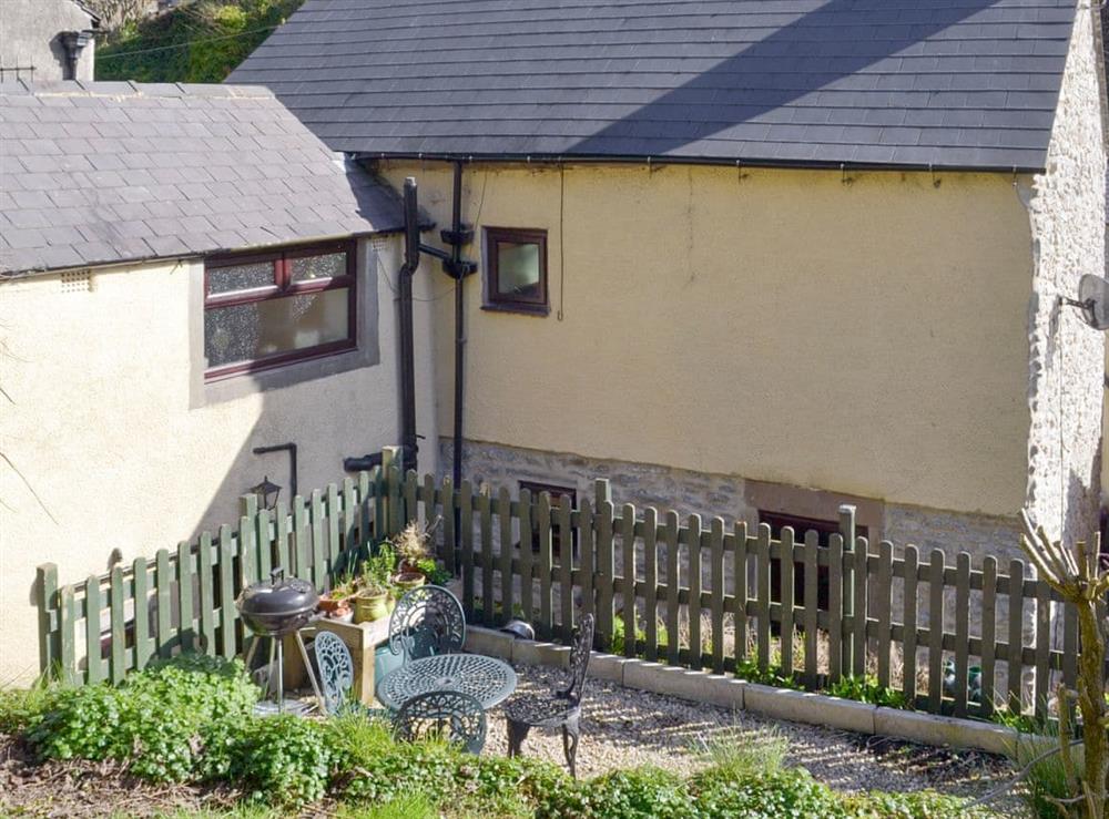 Rear of property with gravelled patio at Poppy Cottage in Bonsall, near Matlock, Derbyshire, England