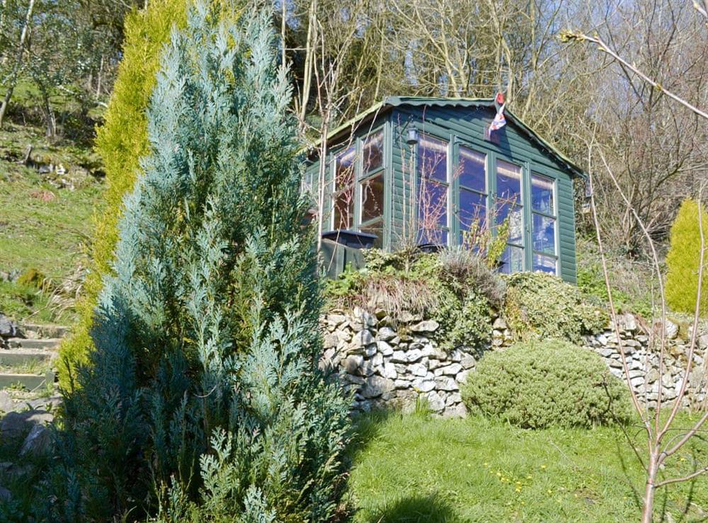 Summerhouse at top of garden at Poppy Cottage in Bonsall, near Matlock, Derbyshire, England