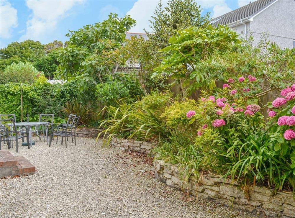 Patio garden with sitting out area at Poppy Cottage in Crantock, Nr Newquay, Cornwall., Great Britain