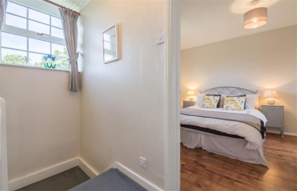 First floor: Master bedroom has lovely views at Poppy Cottage, Docking near Kings Lynn