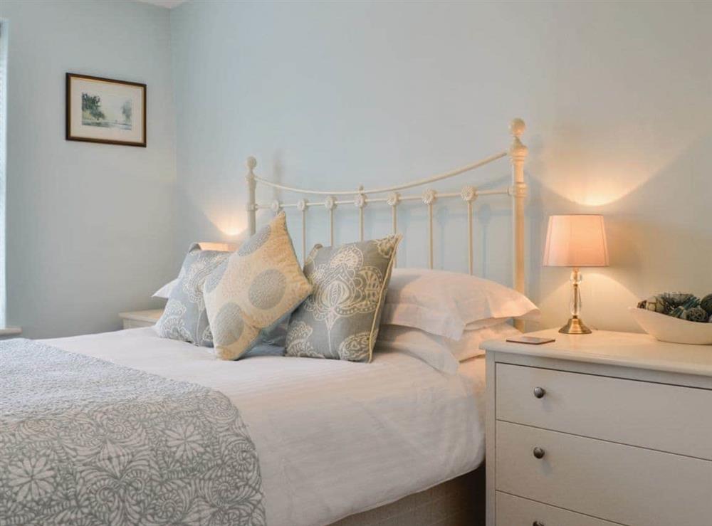 Comfortable bedroom with king sized bed at Poppy Cottage in Hebden, near Grassington, North Yorkshire