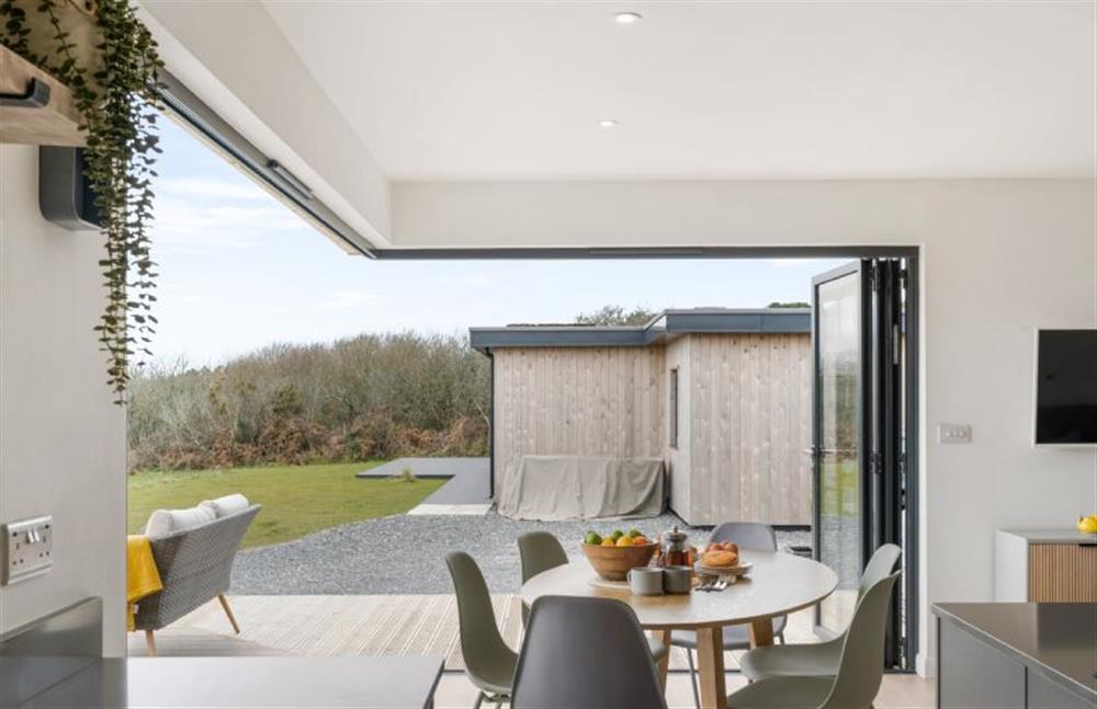 With a dining table capable of seating six and bi-folding doors expanding your space at Poppyfields, Ashton