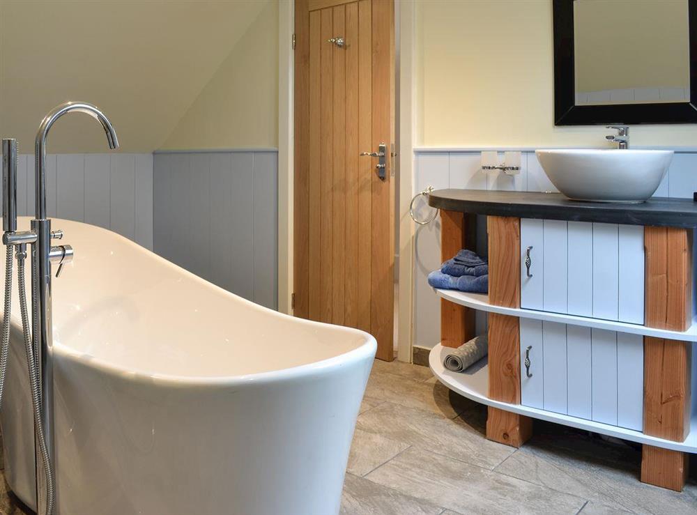 Contemporary bathroom with stand-alone bath at Poppyfields Stable in Scorrier, near St Day, Cornwall