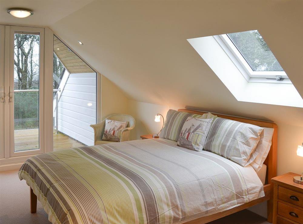 Double bedroom with balcony area at Poppyfields Stable in Scorrier, near St Day, Cornwall
