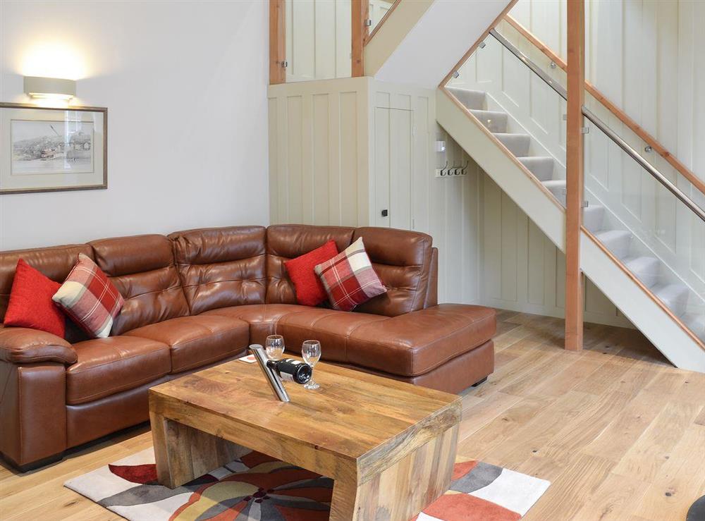 Living room with wood flooring at Poppyfields Stable in Scorrier, near St Day, Cornwall