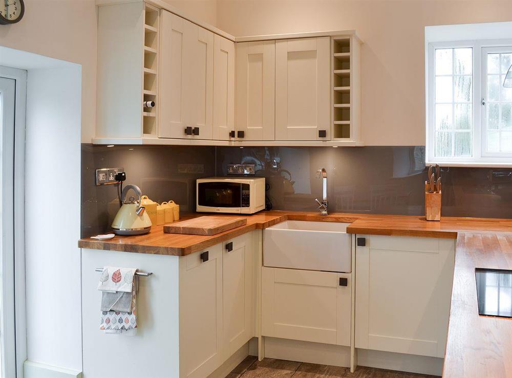 Modern kitchen with french doors at Poppyfields Stable in Scorrier, near St Day, Cornwall