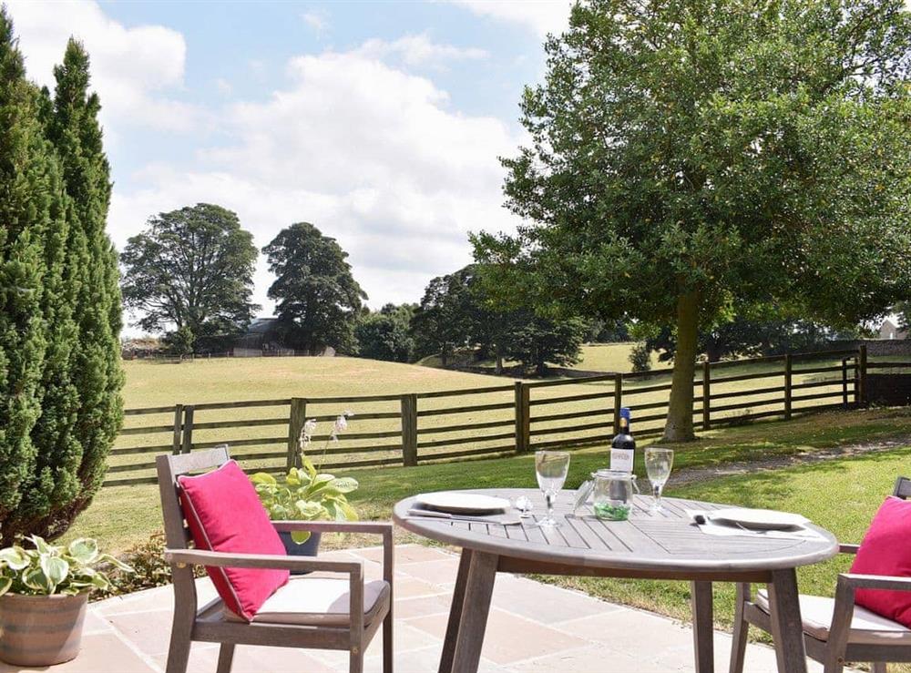Peaceful rural views from the additional patio area at Poppys Footprint in Bedale, North Yorkshire