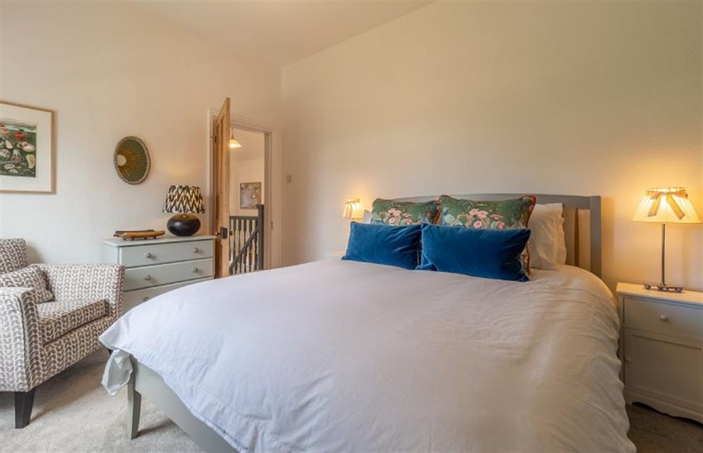 First floor: Bedroom two has a king-size bed at Porch House, Hunstanton