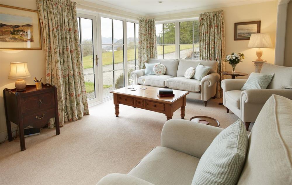 Sitting room with French windows onto the front garden and views of Loch Etive at Port na Mine, Inverawe