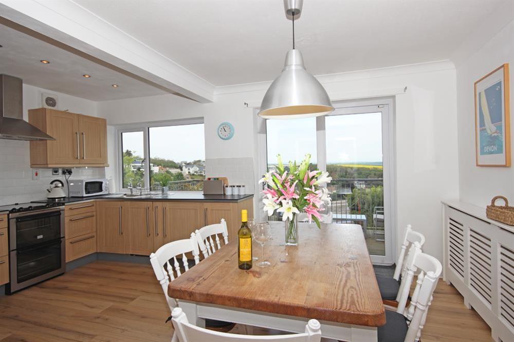 Open plan kitchen/dining area with French doors to decked balcony at Port Royal in , Salcombe