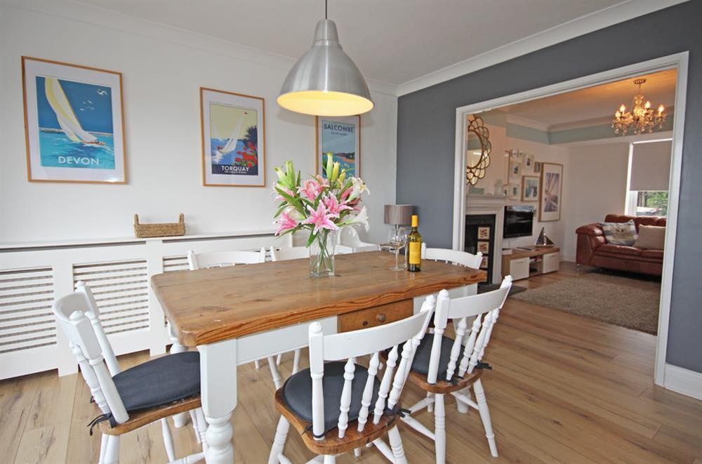 The sitting room opens out to a spacious dining area seating six at Port Royal in , Salcombe