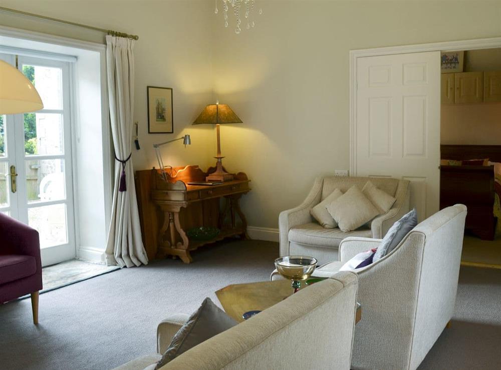 Thoughtfully furnished living room at Porters Lodge in Axminster, Devon